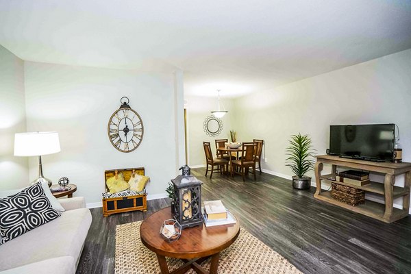 Spacious living room with contemporary furnishings in 3 Corners West Apartments