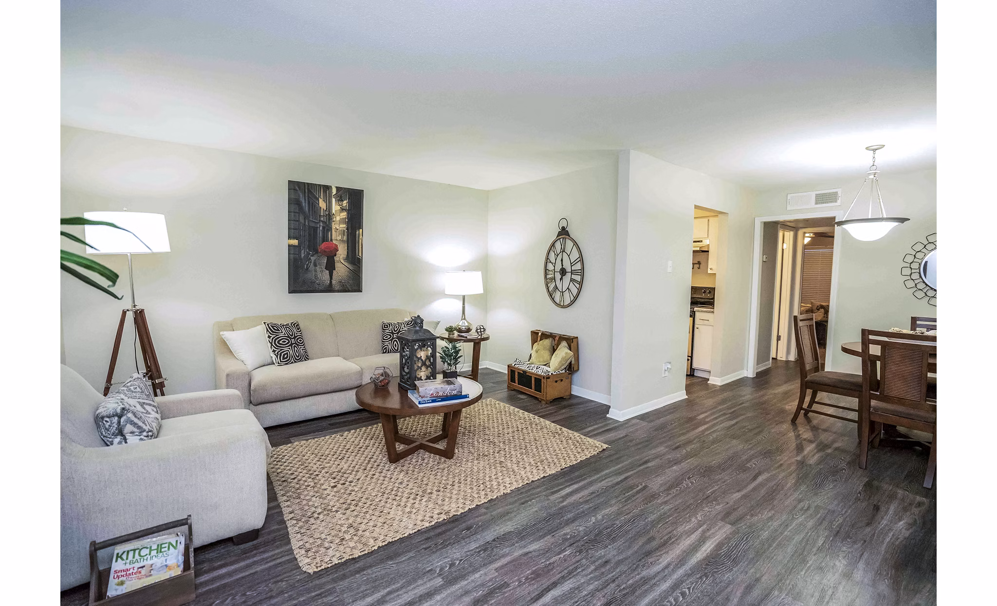 Spacious living room with modern furnishings at 3 Corners West Apartments in Greystar community