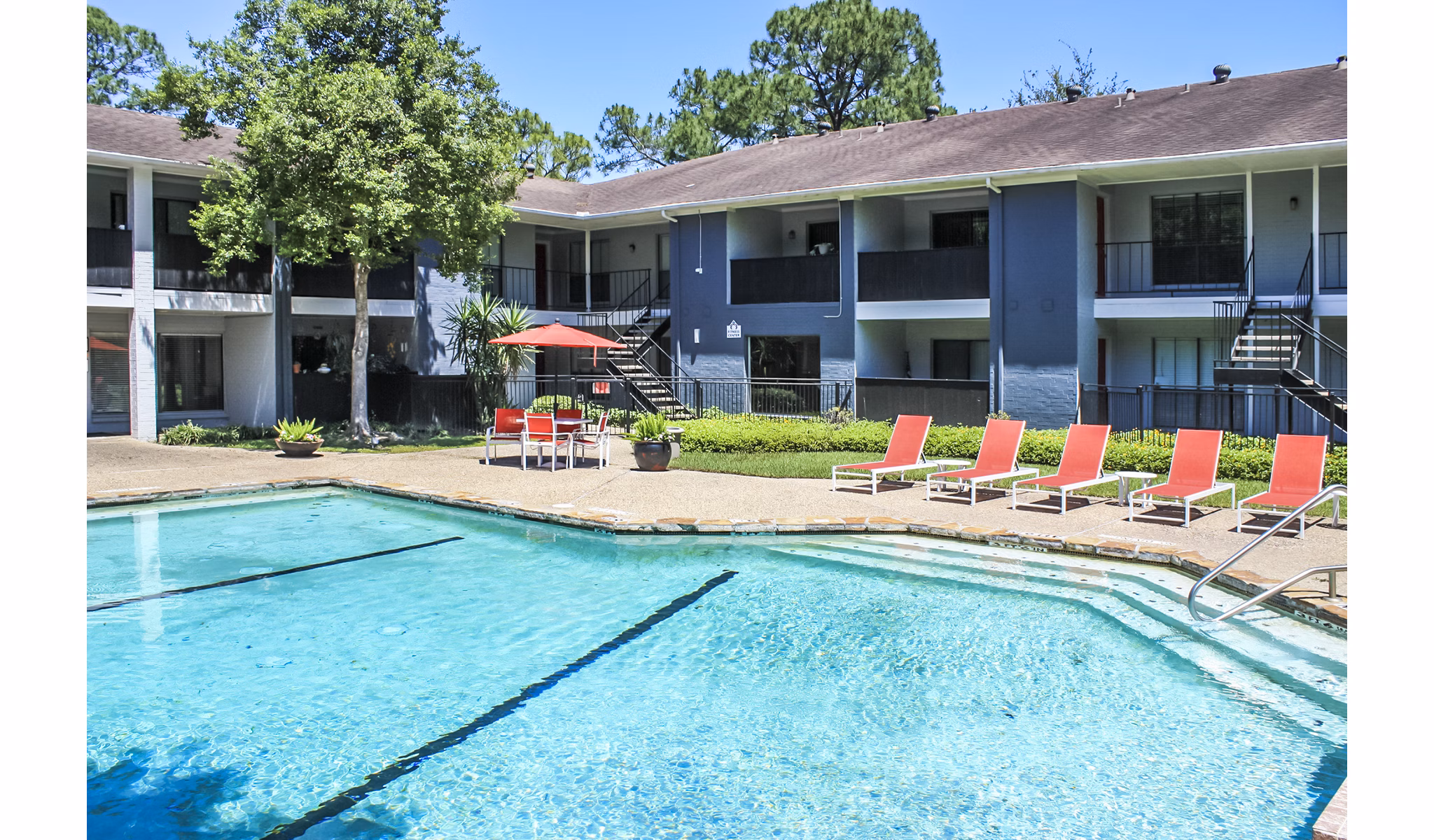Luxurious poolside view at 3 Corners West Apartments offering relaxation and leisure amenities