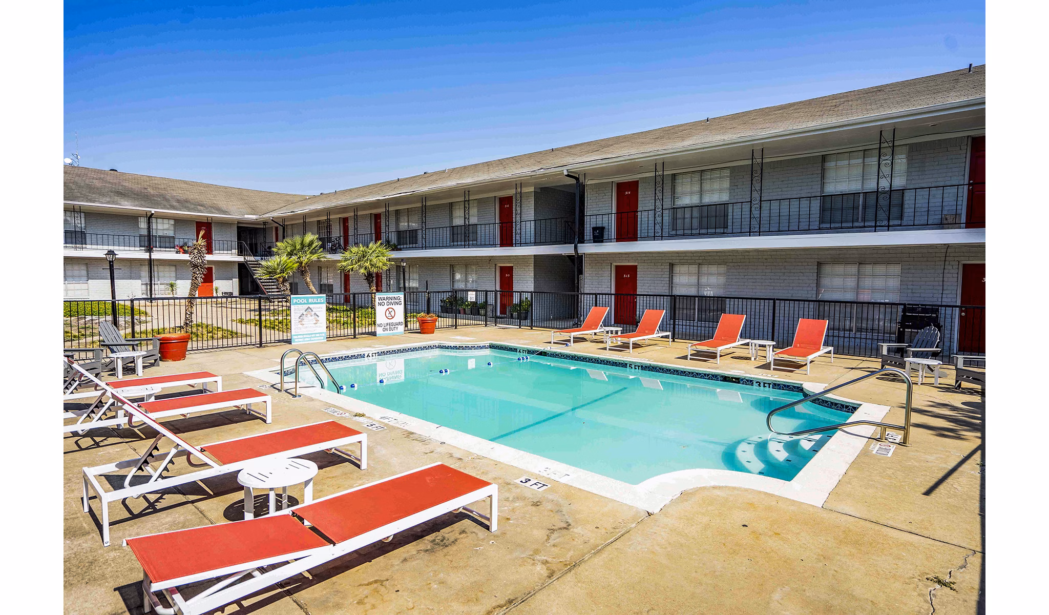 Luxury pool with modern sun loungers at 3 Corners West Apartments, perfect for relaxation and leisure
