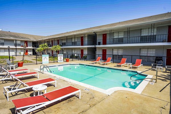 Luxury pool with modern sun loungers at 3 Corners West Apartments, perfect for relaxation and leisure