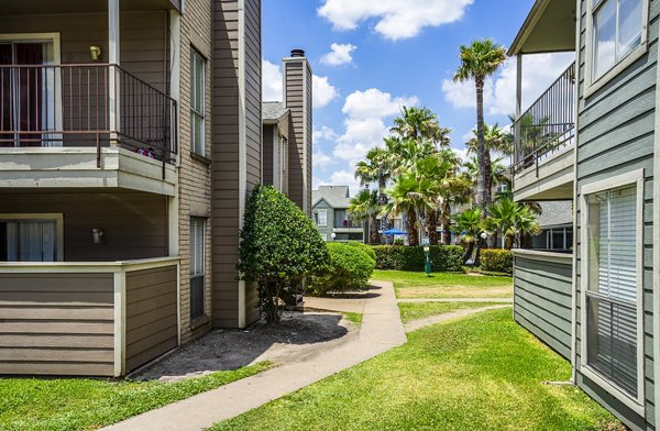 Hammerly Oaks: Modern building amidst lush greenery in a vibrant neighborhood