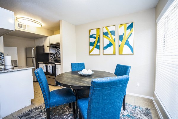 Spacious dining room with modern furnishings at Hammerly Oaks Apartments