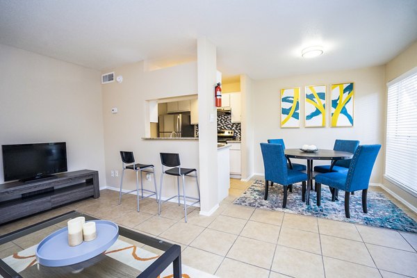 Dining room featuring elegant decor and modern furnishings at Hammerly Oaks Apartments, luxury living by Greystar