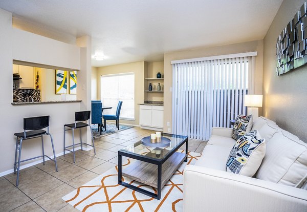Spacious living room with modern decor in Hammerly Oaks Apartments, offering comfort and style