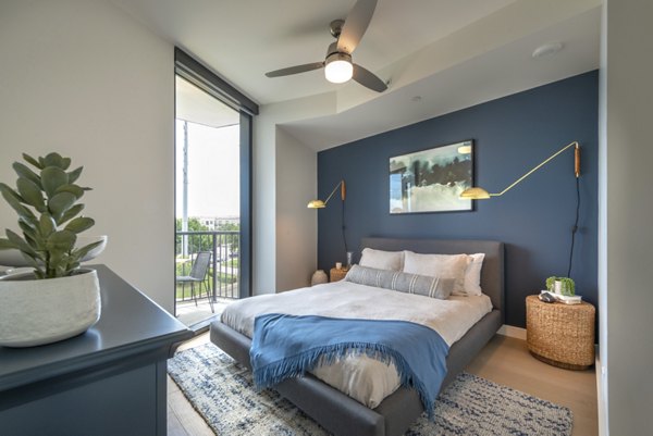 Contemporary bedroom with stylish furniture and natural light at Eastline Residences Apartments