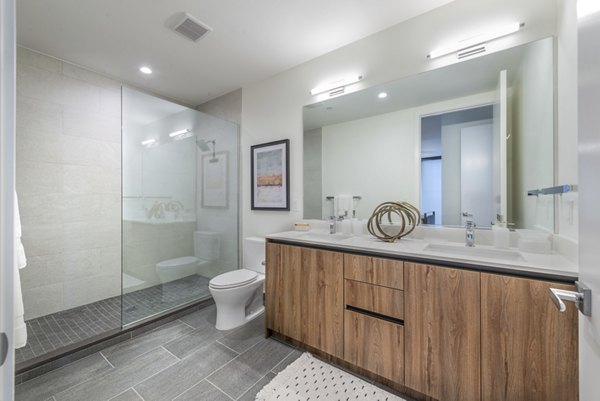 Bathroom featuring modern fixtures and sleek design at Eastline Residences apartments