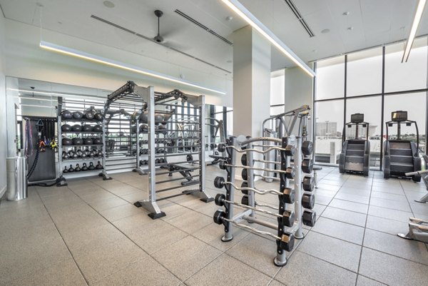 Fitness center with modern equipment at Eastline Residences Apartments
