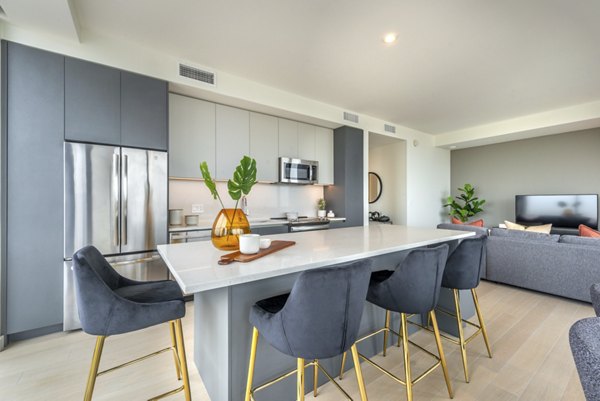 Modern kitchen with stainless steel appliances at Eastline Residences Apartments