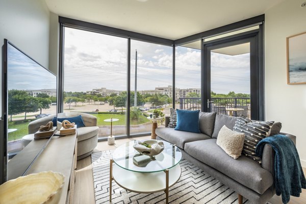 Modern living room with stylish decor and ample natural light in Eastline Residences Apartments