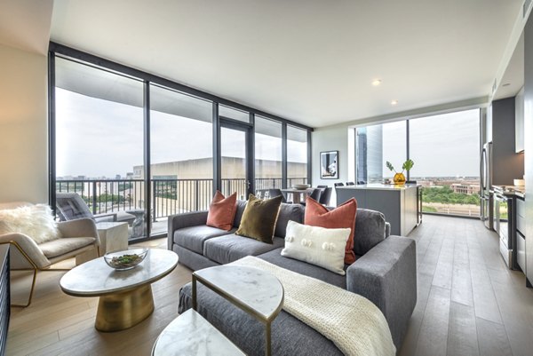 Modern living room with natural light and sleek furnishings at Eastline Residences, luxury apartments