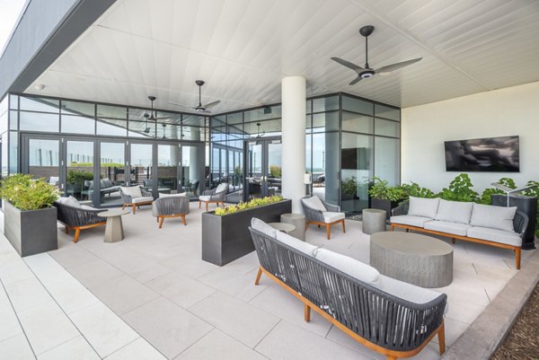 Relaxing patio with modern furniture at Eastline Residences Apartments, ideal for outdoor lounging and social gatherings