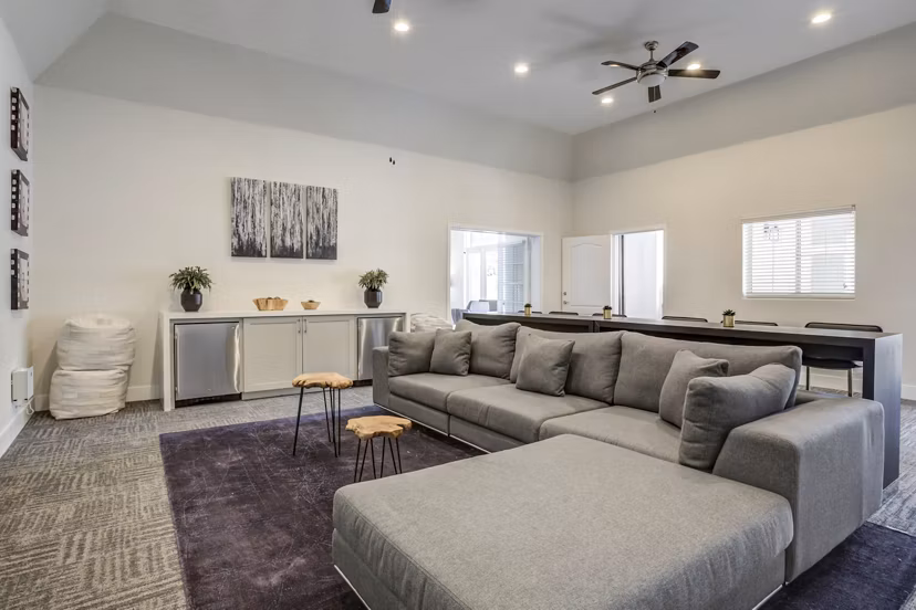 Living room with modern decor and spacious layout at The Sterling Apartments