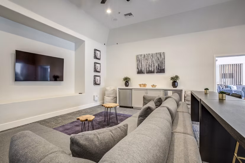 Spacious living room with modern decor and natural light at The Sterling Apartments