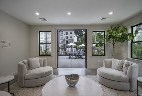 Elegant clubhouse with modern dÃ©cor at Woodside Trumbull Apartments