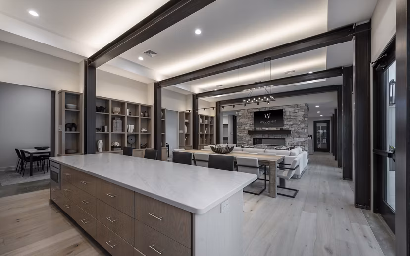 Clubhouse with modern furnishings and entertainment space at Woodside Trumbull Apartments
