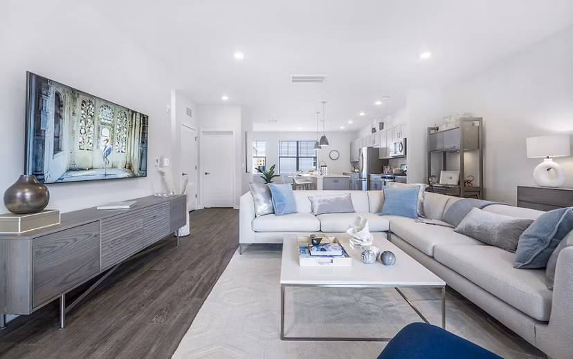 Living room with plush seating and modern decor at Woodside Trumbull Apartments