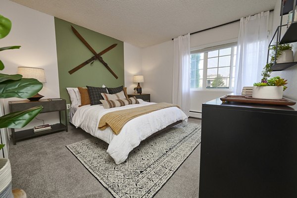 Cozy bedroom with elegant decor at Novi at Lowry Apartments - luxury living in a Greystar-managed community