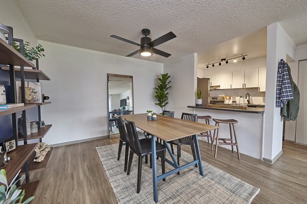Sleek dining area with modern furnishings at Novi at Lowry Apartments, offering luxury living in an elegant setting