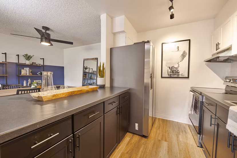 Spacious kitchen featuring stainless steel appliances at Novi at Lowry Apartments