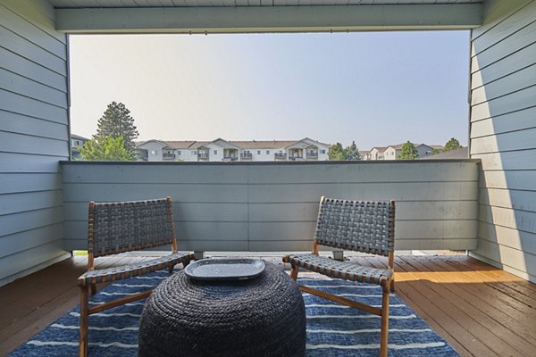 Outdoor patio with modern seating at Novi at Lowry Apartments