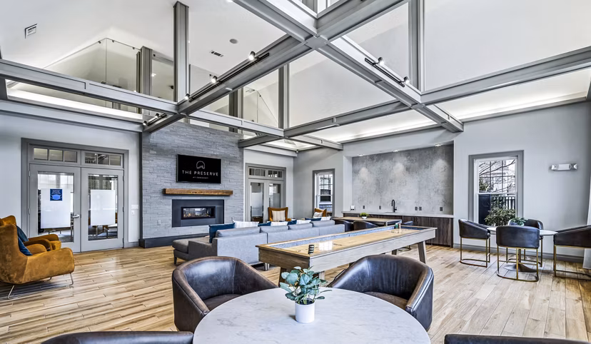Clubhouse with cozy seating and modern decor at The Preserve at Cohasset Apartments, perfect for gatherings and relaxation
