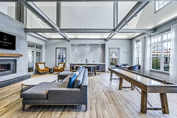 Modern clubhouse with cozy seating at The Preserve at Cohasset Apartments