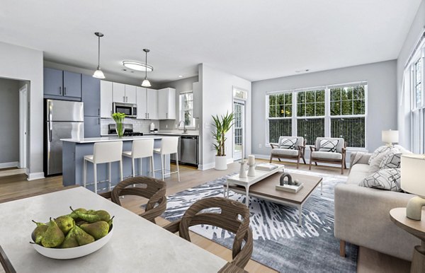 Dining area with elegant chandelier at The Preserve at Cohasset Apartments