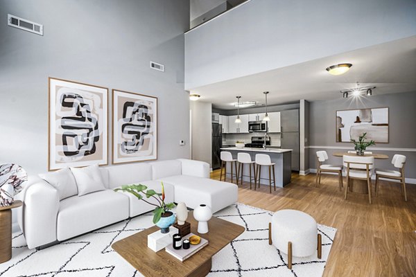 Spacious living room with modern furnishings at The Preserve at Cohasset Apartments