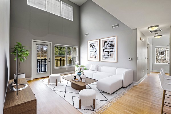 Living room featuring open floor plan and modern decor at The Preserve at Cohasset Apartments