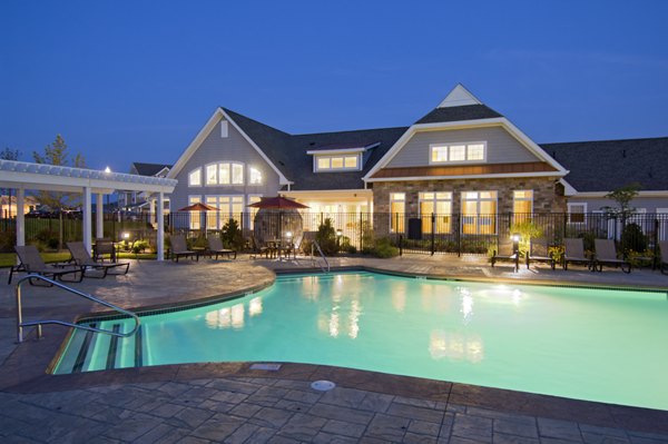 Outdoor swimming pool and barbecue area at Avalon Cohasset luxury apartments in Massachusetts