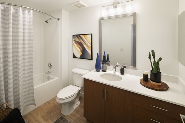 Modern bathroom with sleek fixtures and marble countertops at The Well Apartments, offering luxury living in the heart of a vibrant community