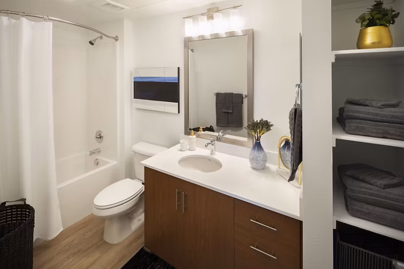 Bathroom showcasing modern fixtures and sleek design at The Well Apartments