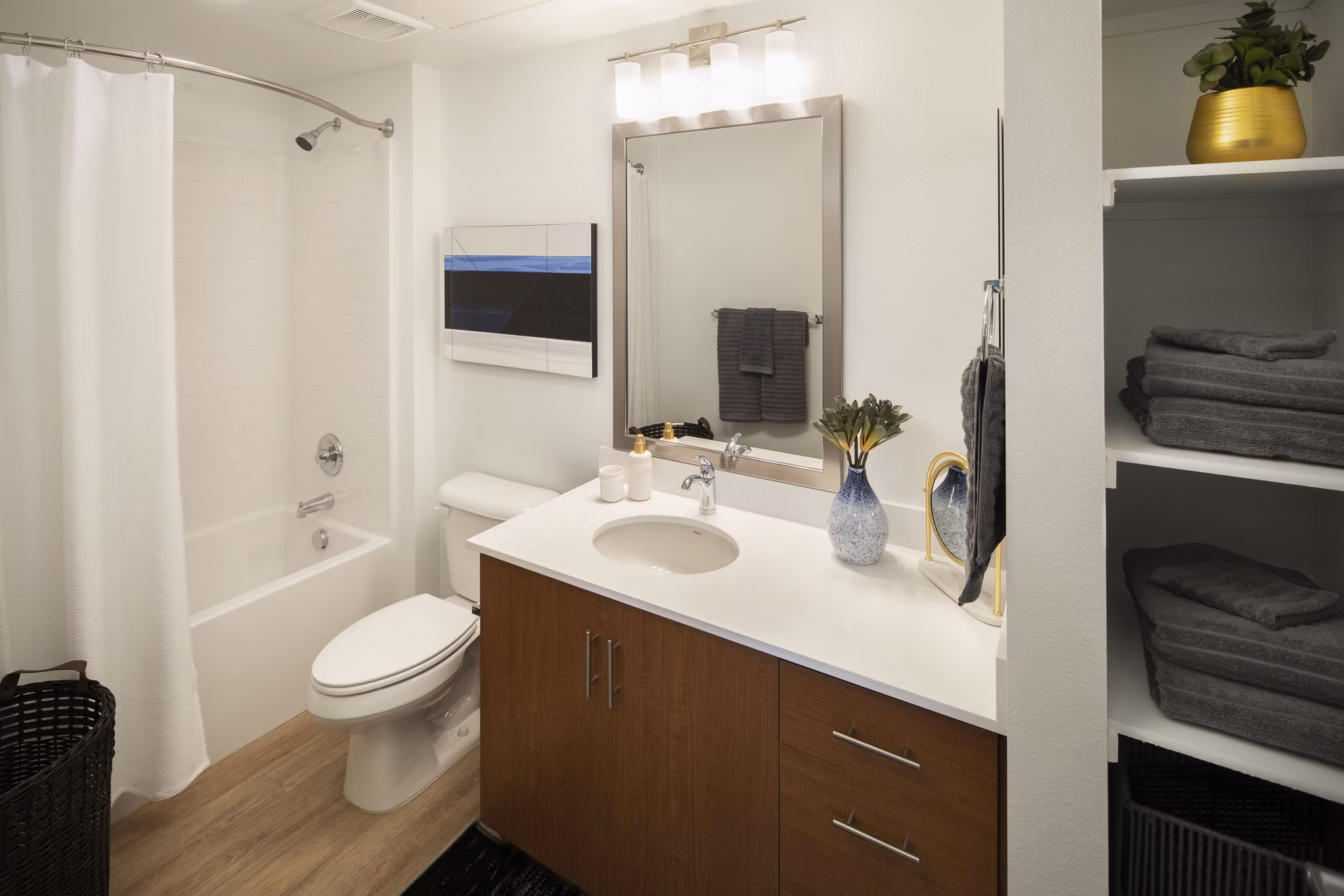 Bathroom showcasing modern fixtures and sleek design at The Well Apartments