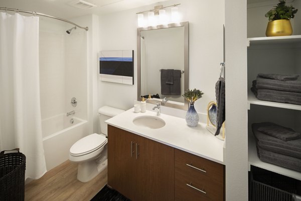 Bathroom showcasing modern fixtures and sleek design at The Well Apartments