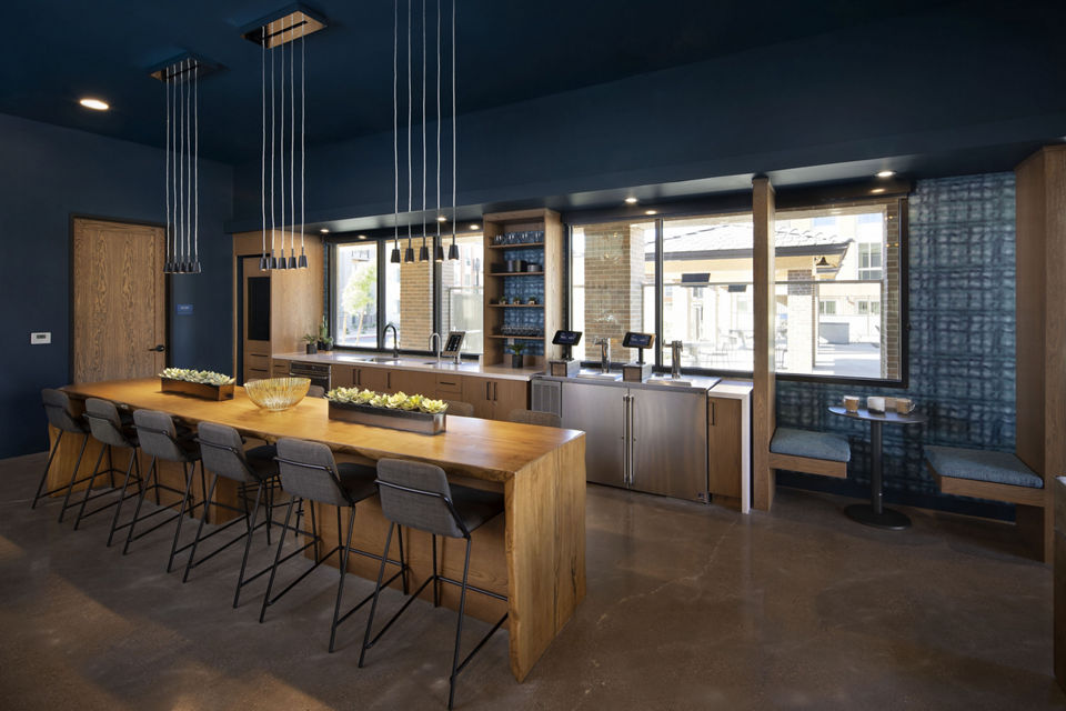 Modern clubhouse with gaming lounge and community space at The Well Apartments, a luxury living destination by Greystar
