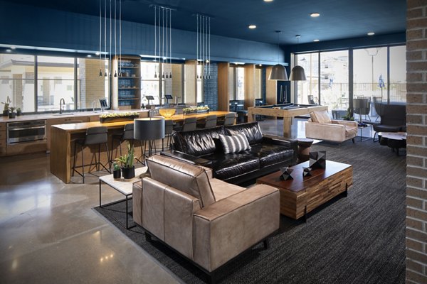 Clubhouse at The Well Apartments featuring modern design and comfortable lounge spaces for residents in a luxury community