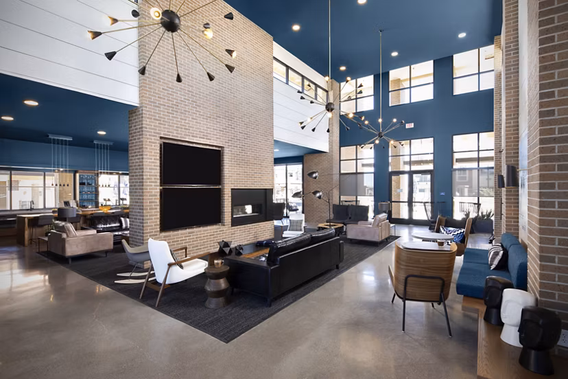 Clubhouse featuring modern decor and lounge seating at The Well Apartments