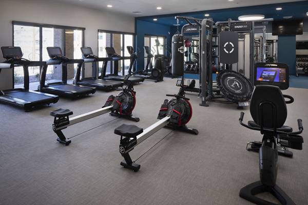 fitness center at The Well Apartments