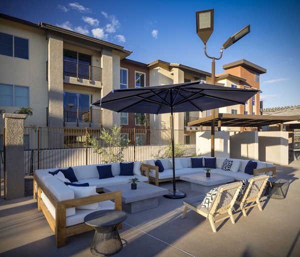 Courtyard with landscaped garden at The Well Apartments featuring Greystar luxury living and modern outdoor seating areas