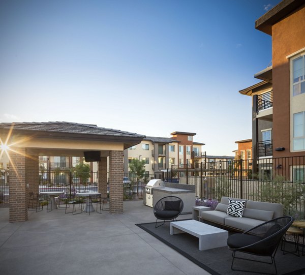 Outdoor grill area with modern seating at The Well Apartments, perfect for social gatherings and leisure, enhancing the luxurious lifestyle offered