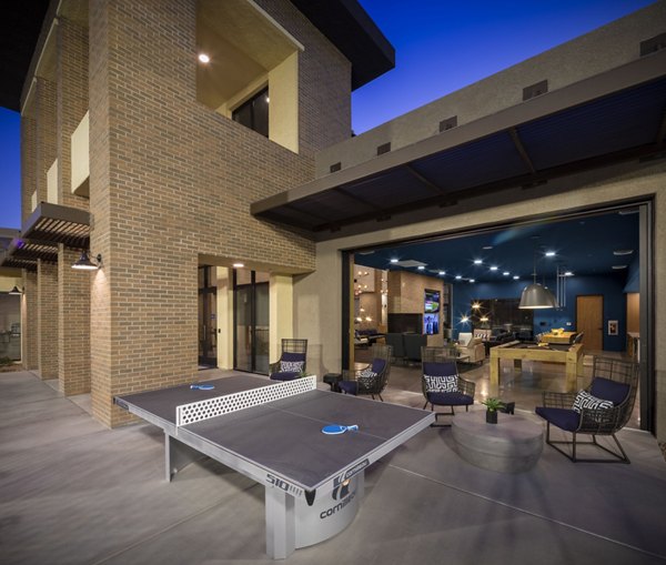 Courtyard at The Well Apartments featuring lush landscaping and outdoor seating