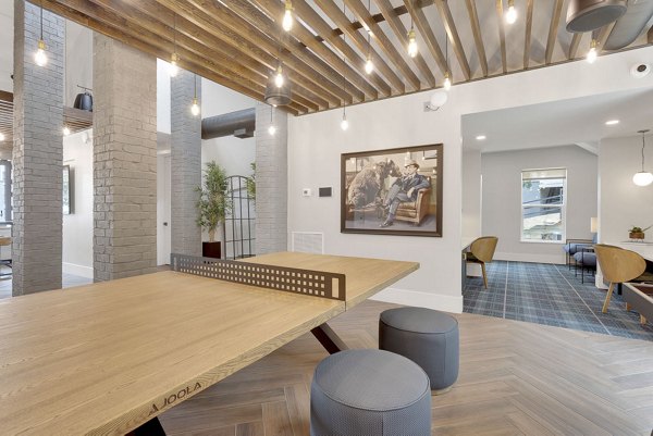 Elegant clubhouse with modern furnishings at The Marks Apartments, perfect for social gatherings and community events