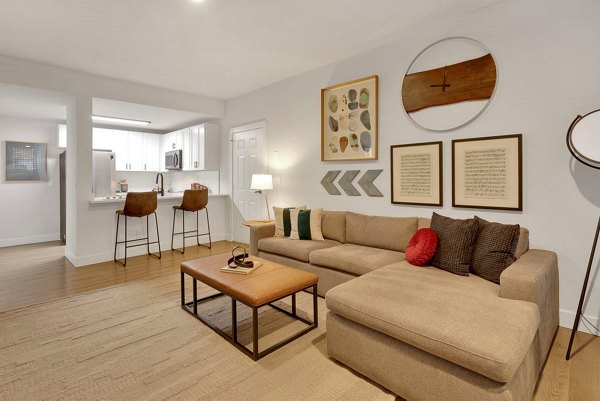 Spacious living room with contemporary decor at The Marks Apartments, ideal for luxury living