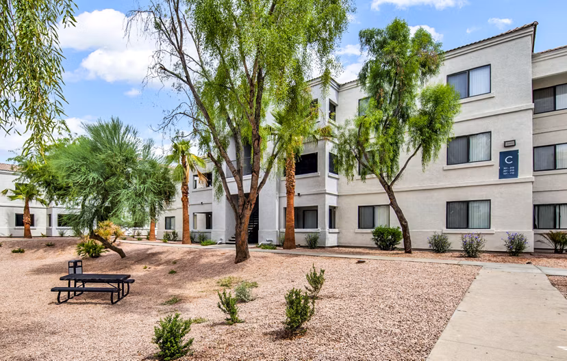 Hue97 Apartments: Inviting courtyard with modern seating and lush landscaping at this downtown Greystar community complex