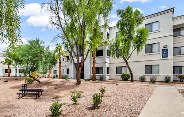 Hue97 Apartments: Inviting courtyard with modern seating and lush landscaping at this downtown Greystar community complex