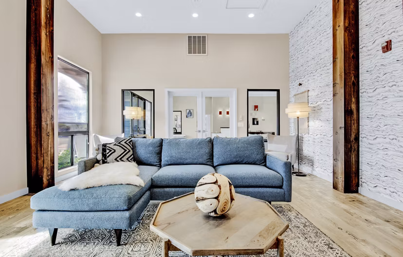 Elegant clubhouse/lounge area at HUE97 Apartments with modern decor and seating