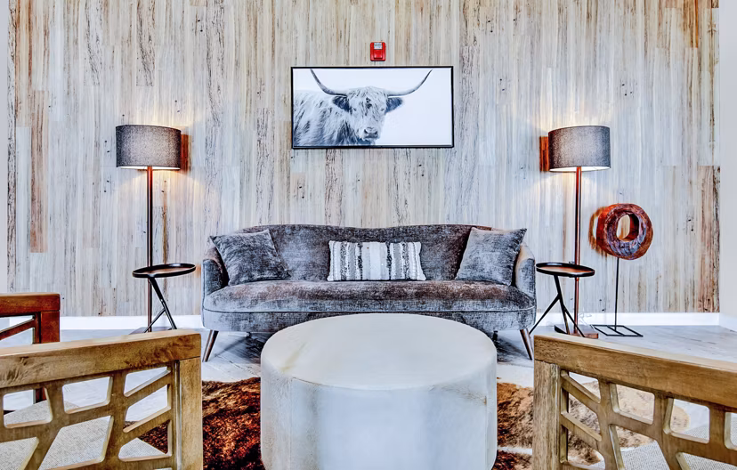 Modern clubhouse/lobby with stylish seating and decor at HUE97 Apartments, luxurious Greystar luxury apartments