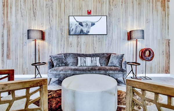 Modern clubhouse/lobby with stylish seating and decor at HUE97 Apartments, luxurious Greystar luxury apartments
