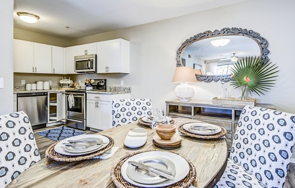Dining room featuring elegant lighting and modern furniture at HUE97 Apartments